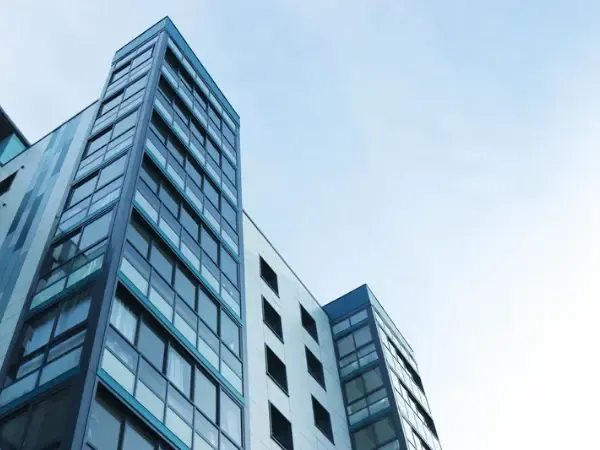 Glass office tower seen from street level