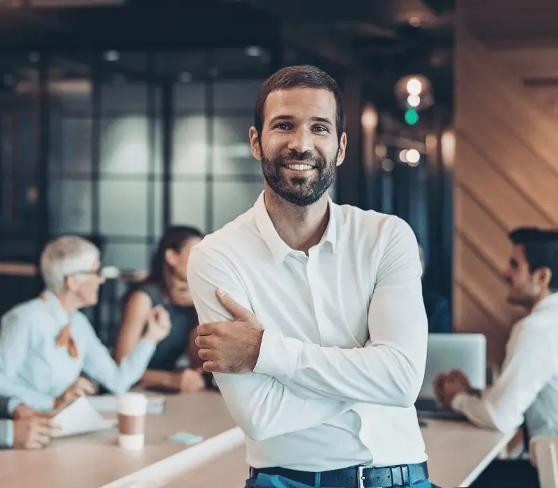 An employer standing in a modern office