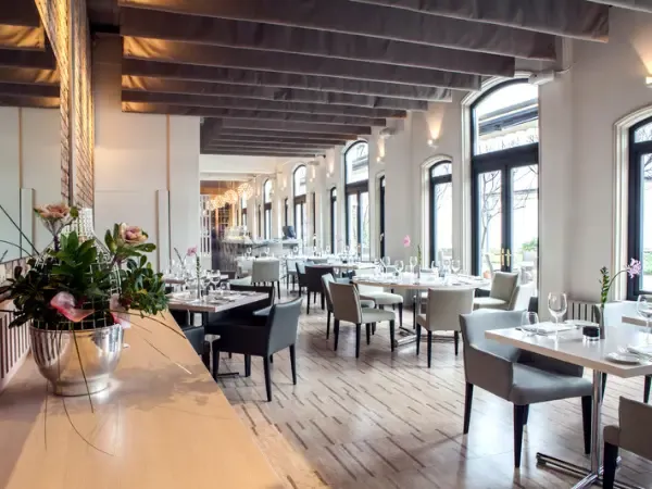 Set tables in a restaurant dining room