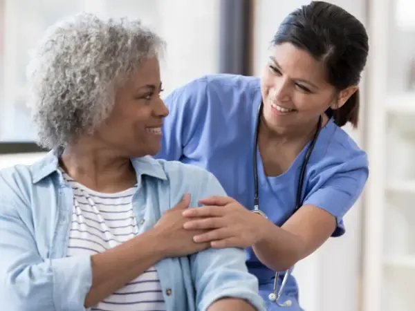 Caregiver talking with a senior resident