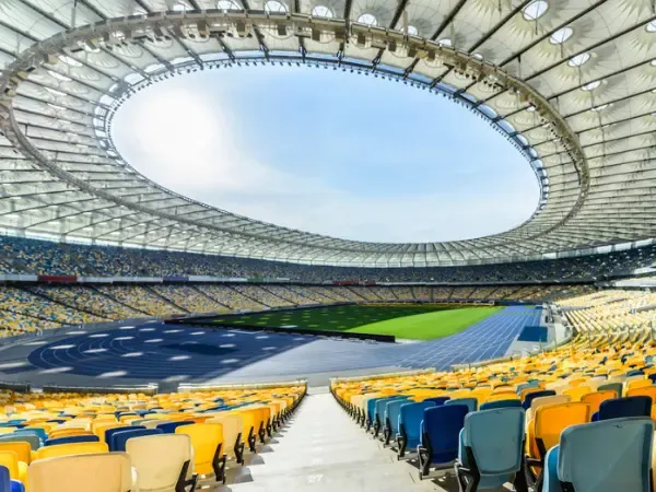 Empty stadium seating bowl and pitch